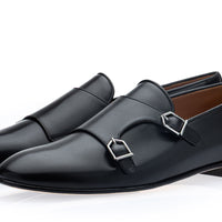 A pair of men's black leather double monk loafers with silver buckle details, displayed on a clean white background. | Image 1