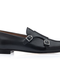 A single black leather double strap loafer with silver-tone buckle hardware, shown in a side profile on a clean white background. | Image 3