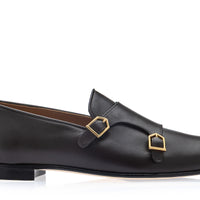 A single cocoa leather loafer with a double strap design and gold-tone buckle hardware, shown in a side profile on a white background. | Image 3