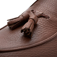 Close-up of Superglamourous Tangerine 8T cognac deer leather loafers, highlighting the textured leather, matching leather tassels and hand-finished stitching on the vamp. | Image 5