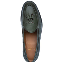 A single dark musk leather loafer with a decorative tassel detail on the vamp, shown from a top-down view against a plain white background. | Image 4