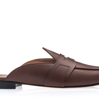 A single brown leather slip-on loafer mule with a pointed toe and a low black block heel, shown in profile against a white background. | Image 3